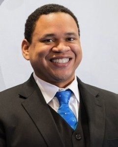 Benjamin Bryant in suit with blue tie