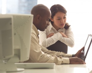 Business Colleagues Working with Laptop ca. 2003